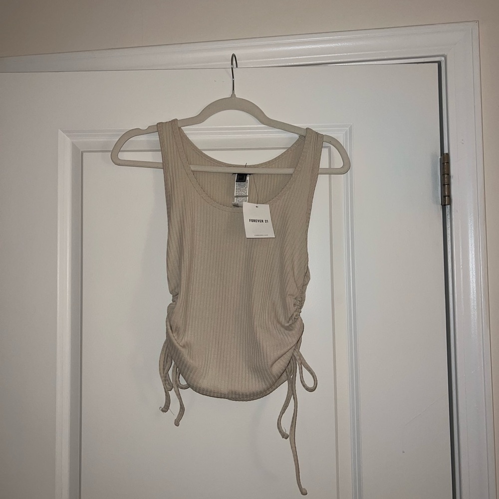 Cream shirt with ties on the side size medium